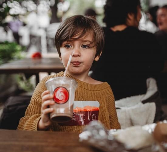 child-drinking-a-chocolate-beverage-3225485