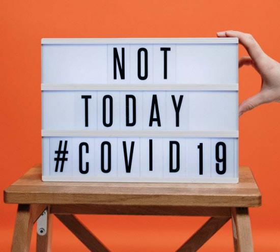 not-today-covid19-sign-on-wooden-stool-3952231