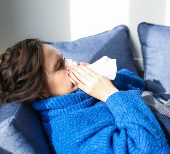 woman-in-blue-sweater-lying-on-bed-3873179